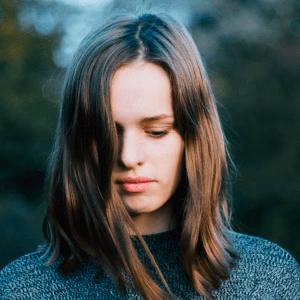 white woman looking down