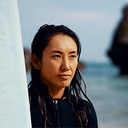 profile photo of a woman surfing